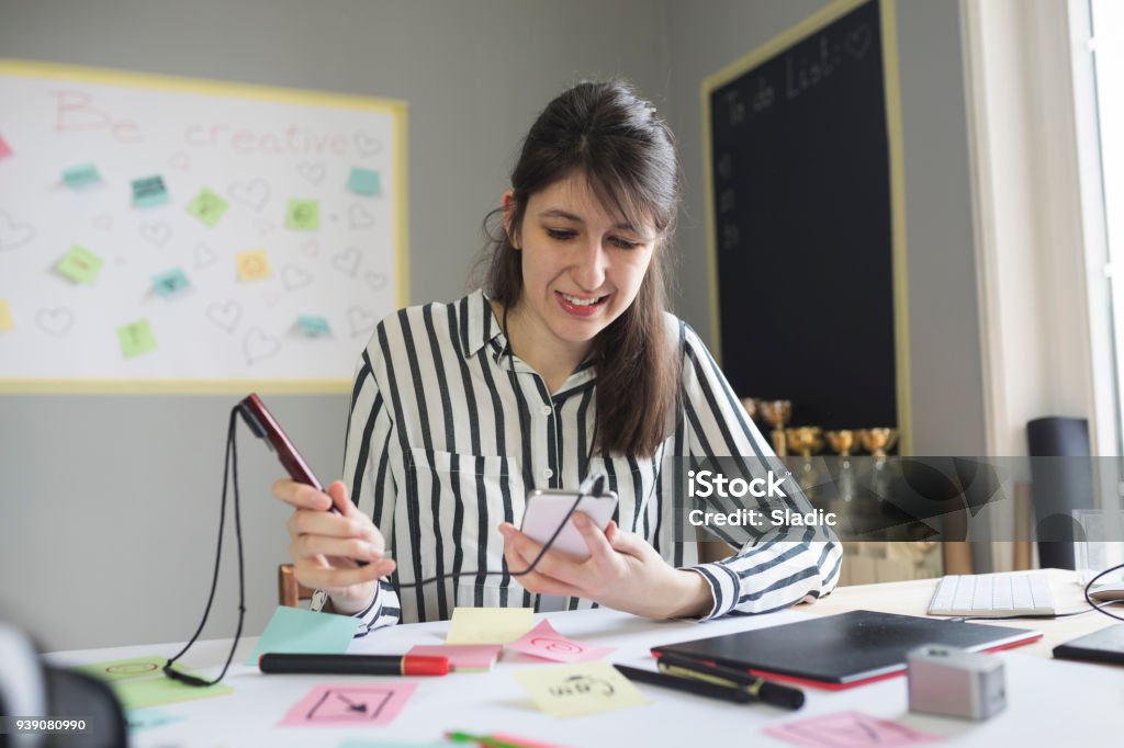 Woman using hearing aid and assisitive tech accessories